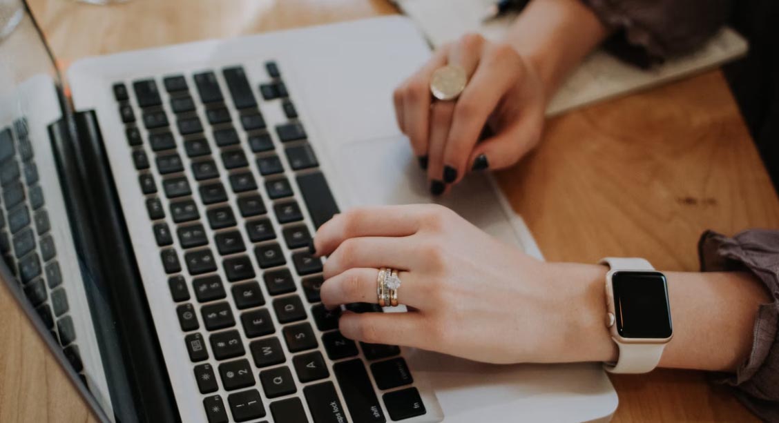 Picture of a woman browsing on her laptop